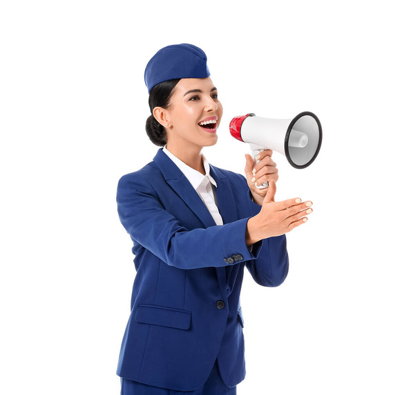 Beautiful stewardess with megaphone on white background - Fotoğraf, Görsel