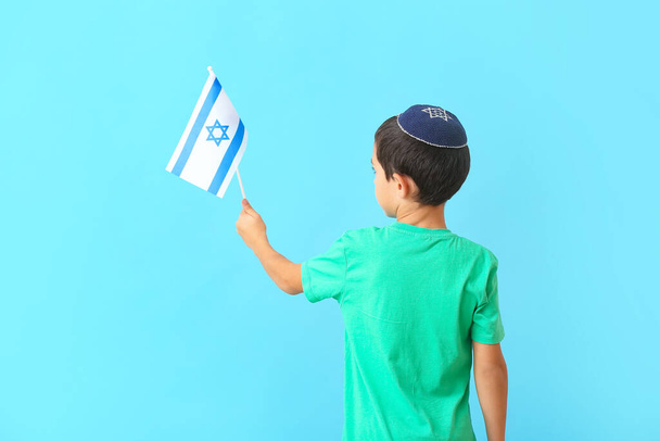 Little boy with the flag of Israel on color background - Фото, изображение