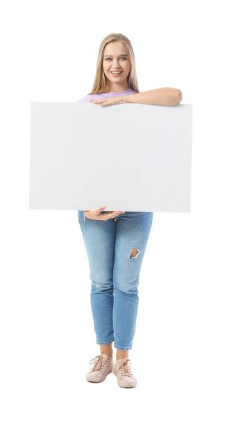 Beautiful young woman with blank poster on white background - Foto, Bild