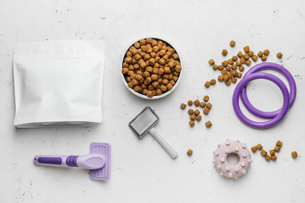 Tasty pet food and accessories on light background - Photo, Image