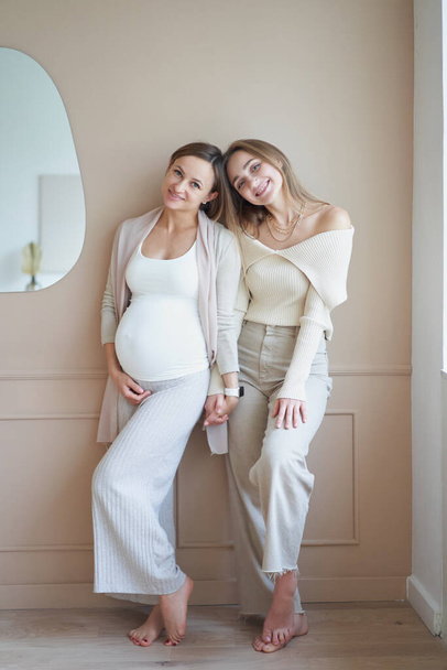 Lesbian couple waiting for baby, woman posing with her pregnant girlfriend - Valokuva, kuva