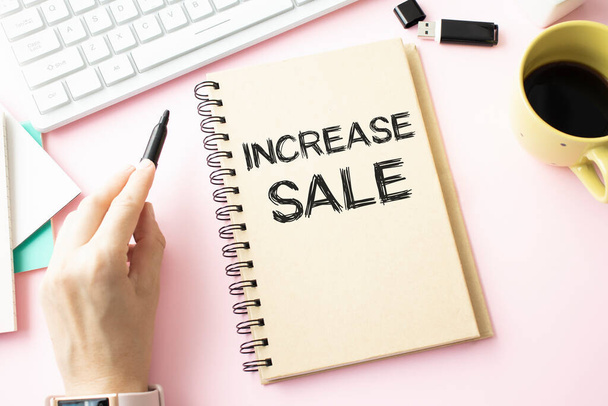 Increase sales text concept write on notebook - Foto, afbeelding