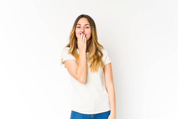 Young caucasian woman isolated on white background shocked, covering mouth with hands, anxious to discover something new. - Photo, Image