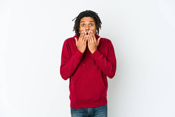 Young african american rasta man shocked covering mouth with hands. - Foto, Imagen