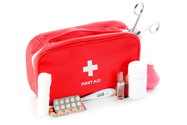 First aid kit with medical supplies isolated on white background - Fotoğraf, Görsel