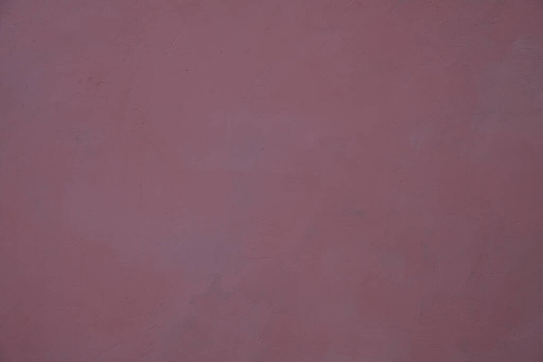 Purple painted stucco, scratches. Homogeneous background. - Photo, image