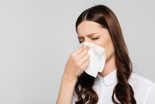 young pregnant businesswoman having runny nose isolated on grey - Photo, Image