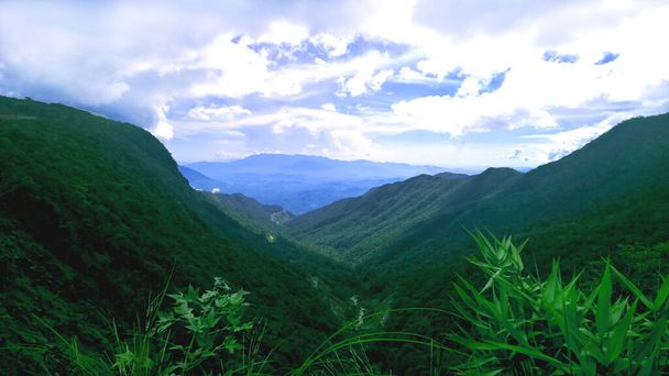 Mountain Landscape of View on road to Da Lat, Vietnam. Beautiful peaceful nature background for restore meditation, relaxation, card. Green & blue mountains at serene highlands of South East Asia.  - Photo, Image