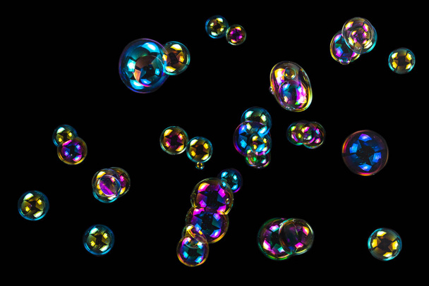 Soap bubbles isolated on a black background. Copy space.  - Foto, immagini