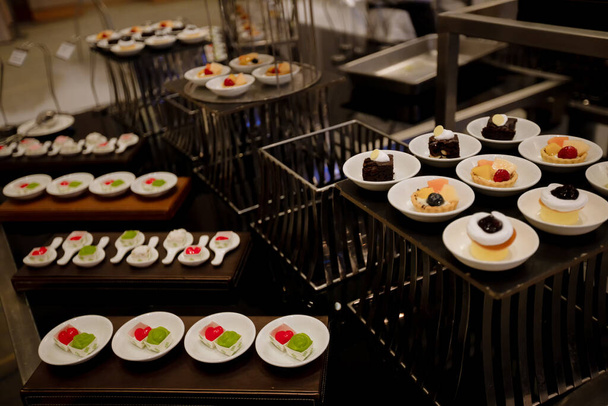 Food Buffet in Luxury Restaurant. Buffet Catering Food Arrangement on Table. The catering wedding buffet for events. dinner cocktail. - 写真・画像