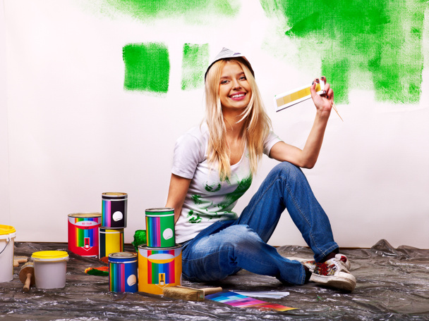 Woman paint wall at home. - Photo, Image