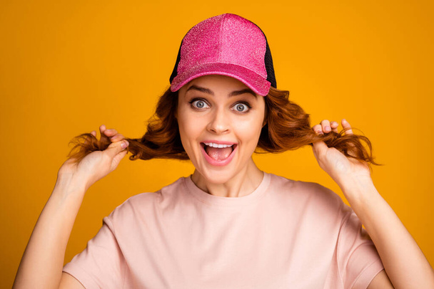 Close-up portrait of her she nice-looking attractive lovely pretty cheerful cheery glad girl making tails hairstyle having fun isolated on bright vivid shine vibrant yellow color background - Foto, Bild