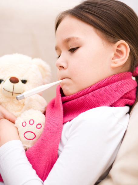 Little girl with thermometer in her mouth - Foto, Bild