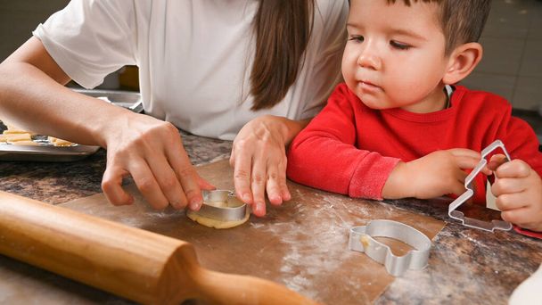 Mother and child make new year cookies. High quality photo - Photo, Image