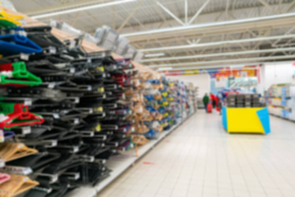 Blurred supermarket background. Selling household goods in a supermarket. - Photo, Image