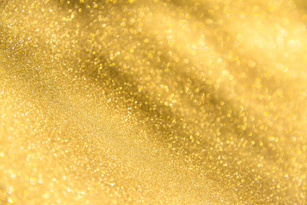 abstract defocused lights, sparkling holiday bokeh background with golden tones, elegant christmas backdrop - Photo, Image