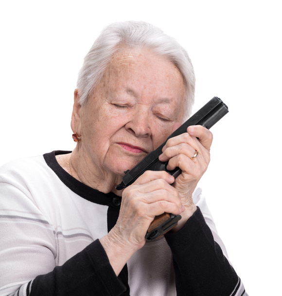 Mulher velha com pistola
 - Foto, Imagem