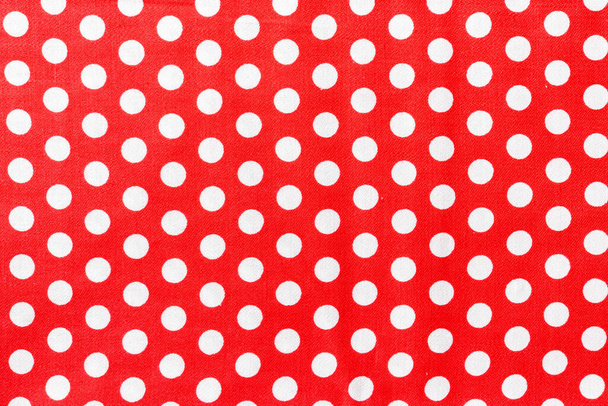 Polka dot on red canvas cotton texture, fabric background. - Photo, Image