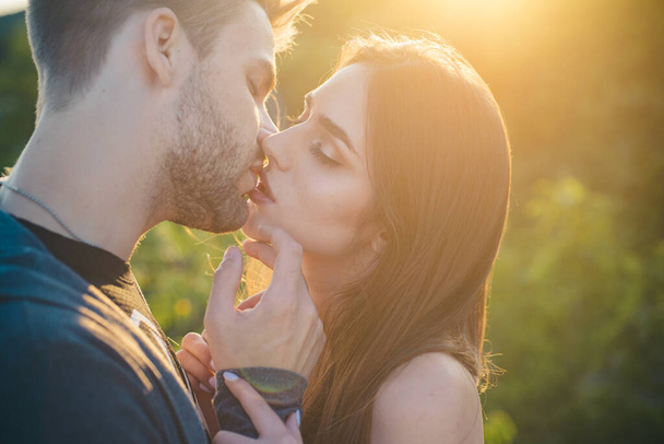 Close-up of young romantic couple is kissing each other. - 写真・画像