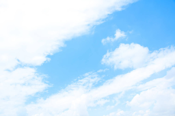 Bright blue sky background with tiny clouds. Sunny day	 - Фото, изображение