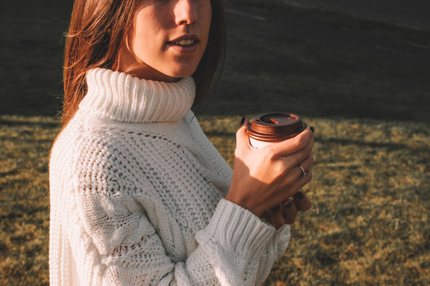 Girl drink coffee. Happy young woman with cup of tea in morning sitting outdoors sunlight. Beautiful female lifestyle. - Φωτογραφία, εικόνα