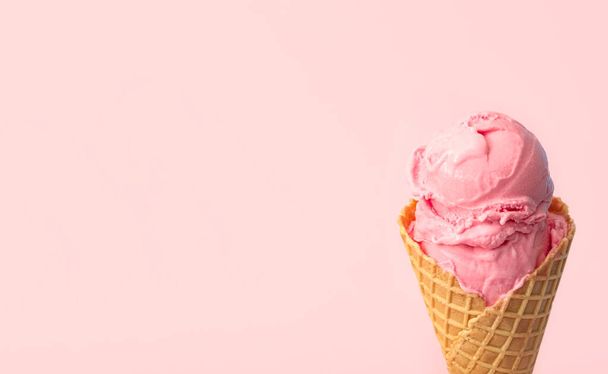 Delicious ice cream in waffle cone on pink background, closeup. Space for text - Foto, Imagem