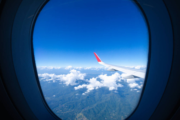 blue sky background from window of the plane  - Photo, Image