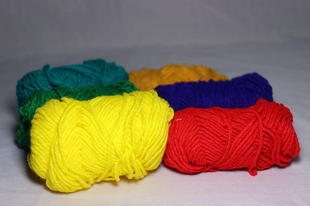 multiple colored yarn stock on white background - Photo, Image