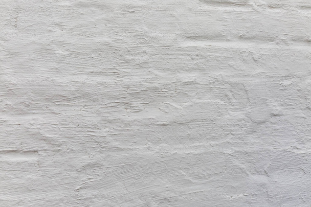 Окрашенная белая бетонная стена. Фон. Пространство для текста. - Фото, изображение