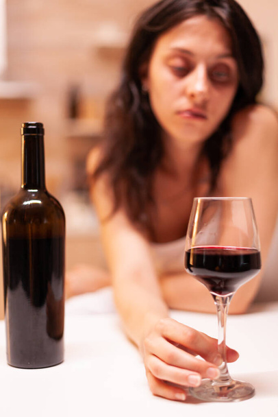 Glass of wine in focus - Фото, зображення
