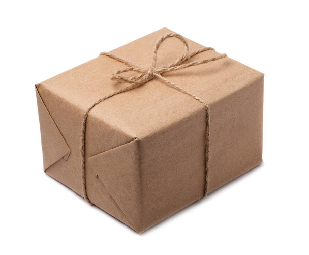 Brown paper parcels ready to be shipped brightly lit on isolated white background - Photo, Image