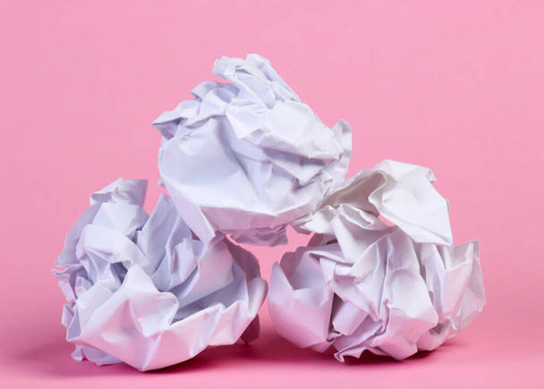 Crumpled paper balls on pink pastel background - Photo, image