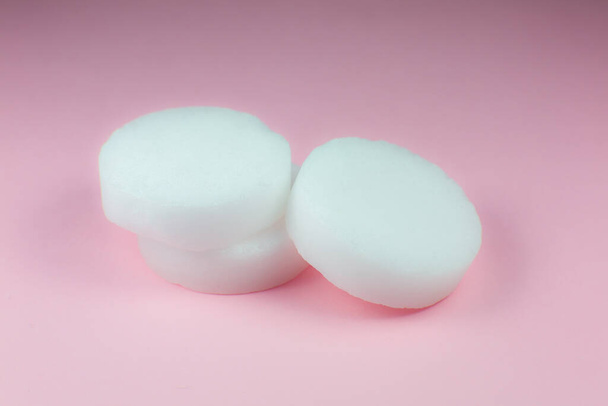 Alcohol burner pills on pink background. Dry alcohol (dry fuel) for flame. Close up. - Photo, Image