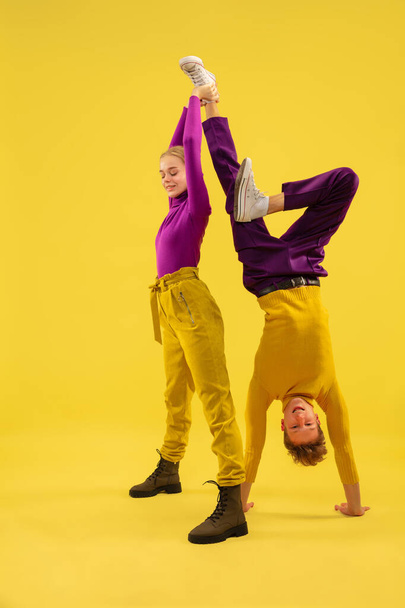 Portrait of two friends going crazy, having fun. Bright clothes, trendy colors. - Fotó, kép