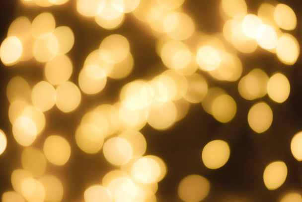 Festive garland bokeh background defocused. Background for greeting cards and postcards. Round bokeh balls. Round bokeh light. - Photo, Image
