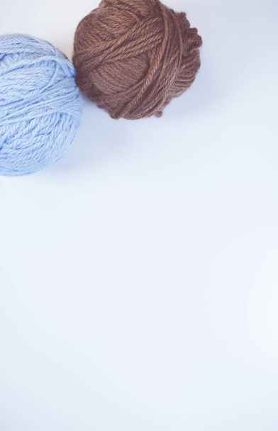 A vertical shot of balls of yarn on a rough surface - copy space - Φωτογραφία, εικόνα