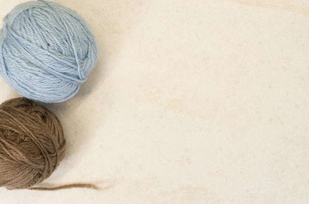 A high angle shot of balls of yarn on a rough surface - Zdjęcie, obraz