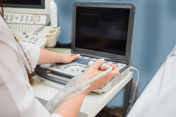 Doctors hands operating modern portable medical equipment - Zdjęcie, obraz