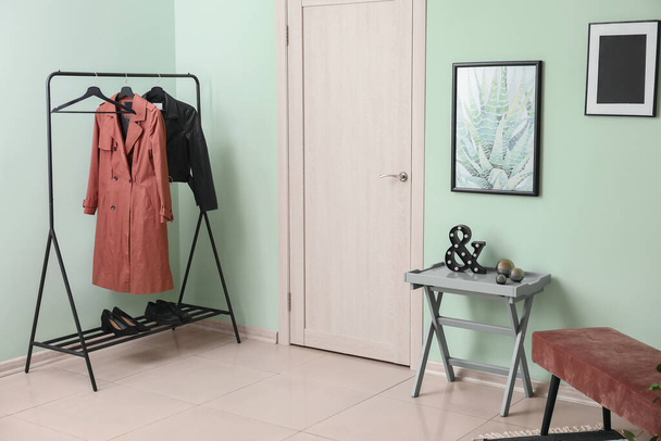 Stylish interior of modern hall with clothes rack - Photo, Image
