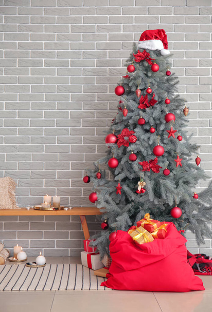 Interior of modern room with Christmas tree and Santa bag - Photo, Image