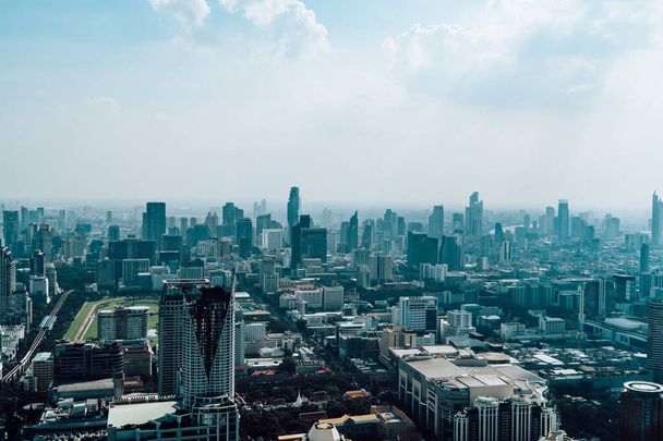 Bangkok, Thailand - February 2, 2020 - Bangkok skyline of Sukhumvit with the King Power Mahanakhon under smog seen from Baiyoke Tower - 写真・画像