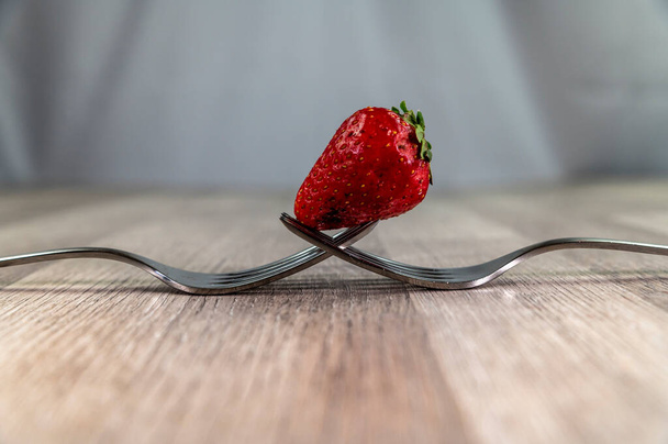 composition with strawberry and forks - Photo, Image