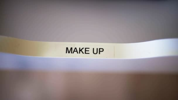 Close up of make up label on an open white drawer - Footage, Video