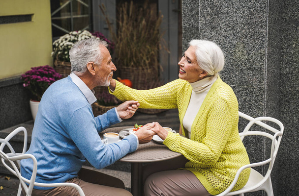 Beautiful senior couple dating outdoors - Mature couple portrait, concepts about elderly and lifestyle - Foto, Imagen