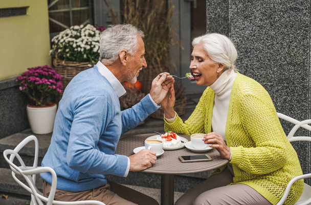Beautiful senior couple dating outdoors - Mature couple portrait, concepts about elderly and lifestyle - 写真・画像