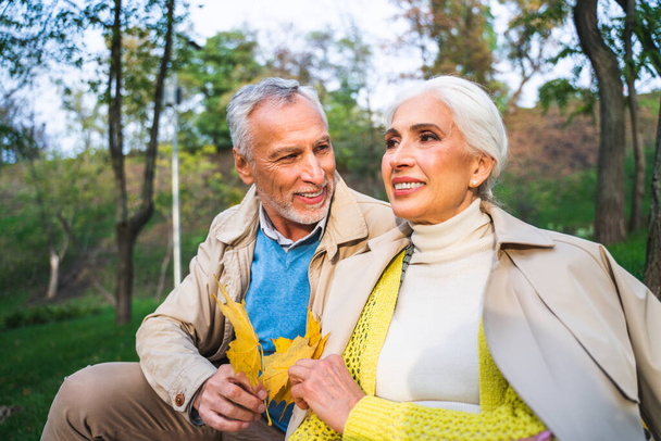 Beautiful senior couple dating outdoors - Mature couple portrait, concepts about elderly and lifestyle - Fotó, kép