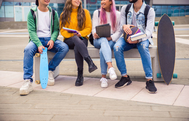 Happy young people meeting outdoors - Group of cheerful teenagers having fun, concepts about teenage, lifestyle and generation z - Photo, image