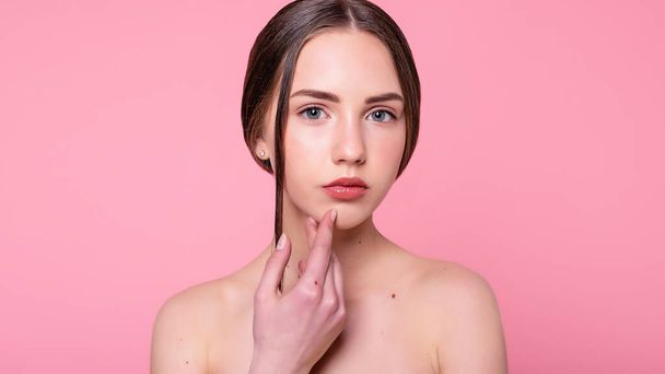 Portrait with copy space of charming, cheerful, trendy, attractive, adorable, naked, shirtless girl with modern make up, perfect, ideal skin, isolated on pink background. 16:9 panoramic format. - Fotoğraf, Görsel