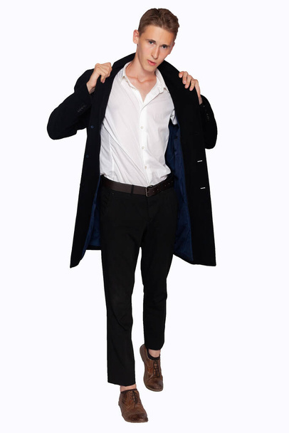 portrait of a man in a black coat and trousers on a white background - Foto, Imagem