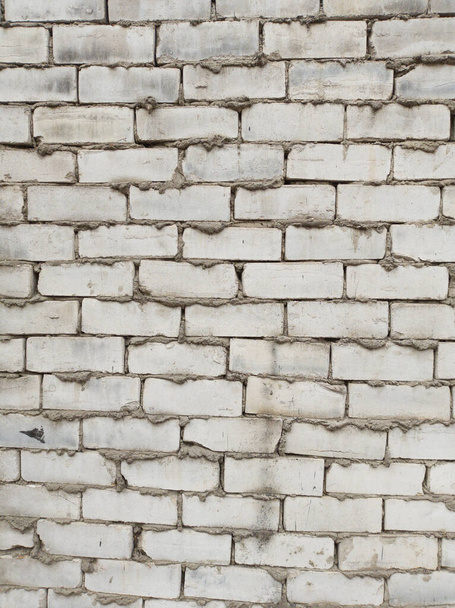textura de la pared de ladrillo gris áspero, con cemento entre ladrillos - Foto, Imagen